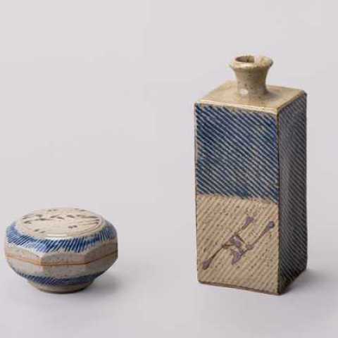 William Plumptre, Lidded Box, thrown and cut sided with inlaid colbalt slip, iron decoration and wood ash glaze, 2020. Press Moulded Square Bottle, inlaid colbalt slip, iron decoration and wood ash glaze, 2020. Photo by Mark Woods.