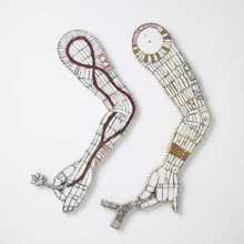 two mosaic arms made from reclaimed ceramic